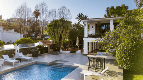 Charming house for sale in Nueva Andalucia with private pool, lush garden, and spacious outdoor living area