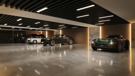 Ambience Marbella luxury villa private garage with modern lighting, polished flooring, and a showcase of premium cars