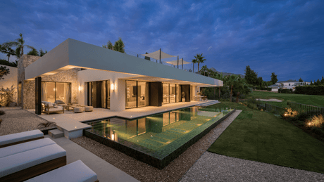 Modern luxury villa designed by Ames Architects in Marbella, featuring sleek architecture, an infinity pool, and serene views of the surrounding landscape at twilight