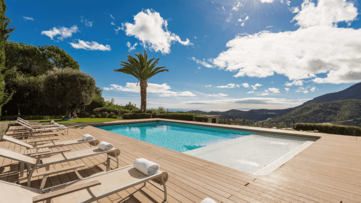 Stunning villa in La Zagaleta with panoramic sea views, a luxurious infinity pool, expansive deck with sun loungers, and set in an exclusive gated community surrounded by lush landscapes