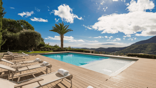 Stunning villa in La Zagaleta with panoramic sea views, a luxurious infinity pool, expansive deck with sun loungers, and set in an exclusive gated community surrounded by lush landscapes