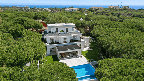 Marbella east beach villa for sale with lush greenery and a private pool