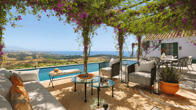 Mediterranean-style villa with sea views and outdoor lounge area for sale in Finca Cortesin