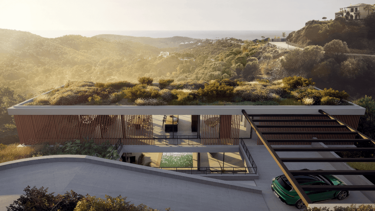 Modern luxury villa for sale in Monte Mayor, Benahavis with green rooftop, panoramic mountain views, and contemporary architecture