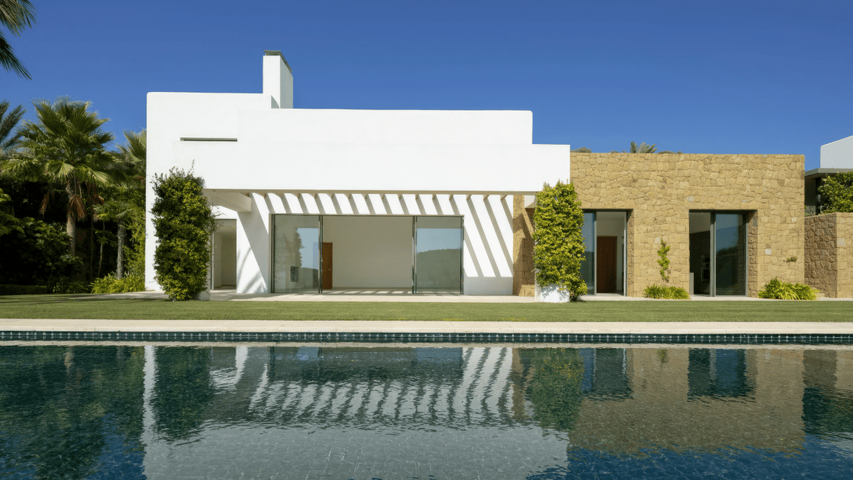 Contemporary villa for sale with sleek lines, a spacious garden, and a private pool at Finca Cortesin, for sale