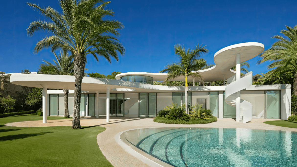 Modern villa for sale featuring a unique design, curved architecture, and a private pool at Finca Cortesin, for sale