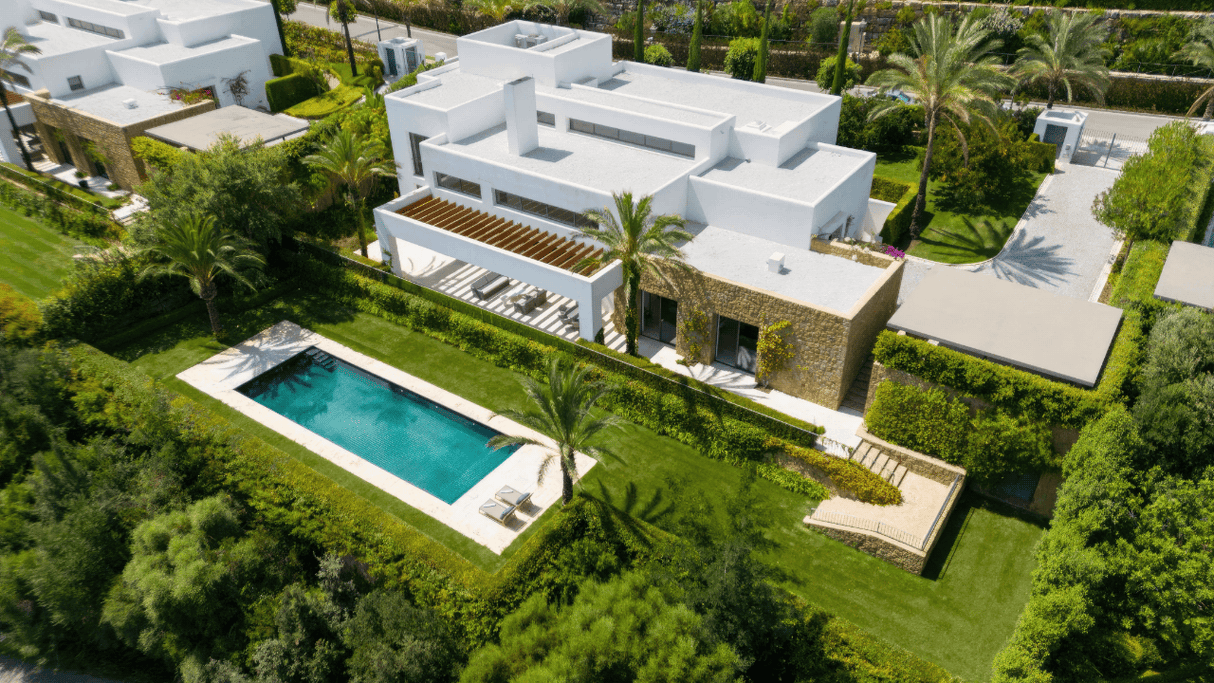 Frontline golf villa for sale surrounded by greenery and boasting a private pool at Finca Cortesin