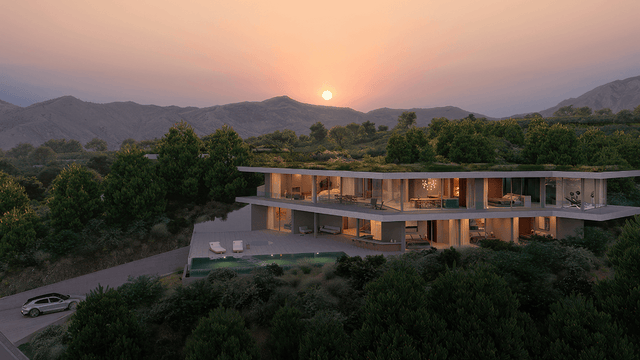 Modern luxury villa for sale in Monte Mayor, Benahavis with panoramic mountain views, sleek architecture, and sunset backdrop