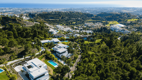 Luxury villas for sale in La Reserva de Alcuzcuz Marbella surrounded by serene greenery