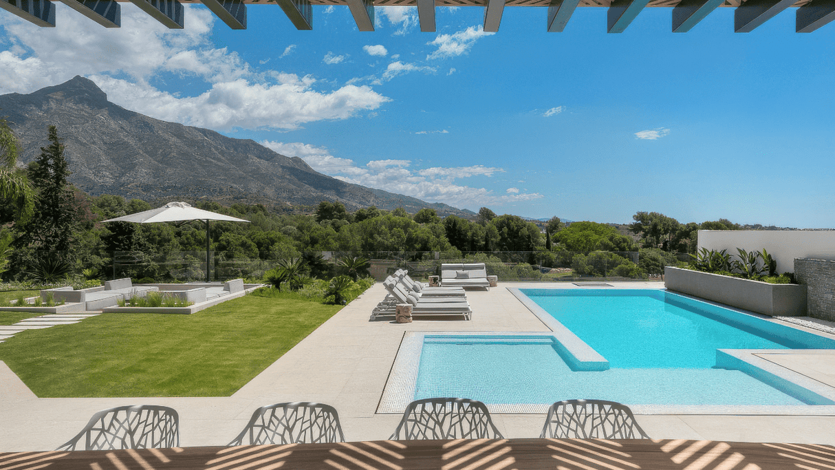 Luxury villa for sale in Nueva Andalucia with panoramic mountain views and modern pool