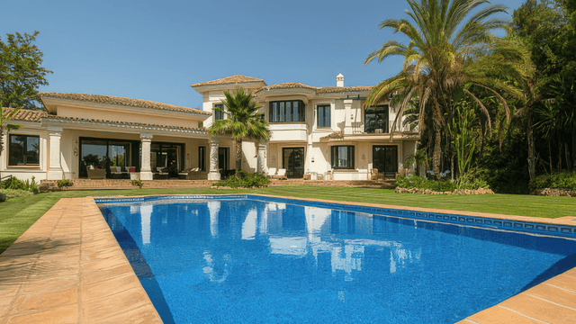 Elegant Mediterranean-style villa with a private pool, lush gardens, and spacious outdoor seating areas in La Zagaleta, offering luxury and tranquility